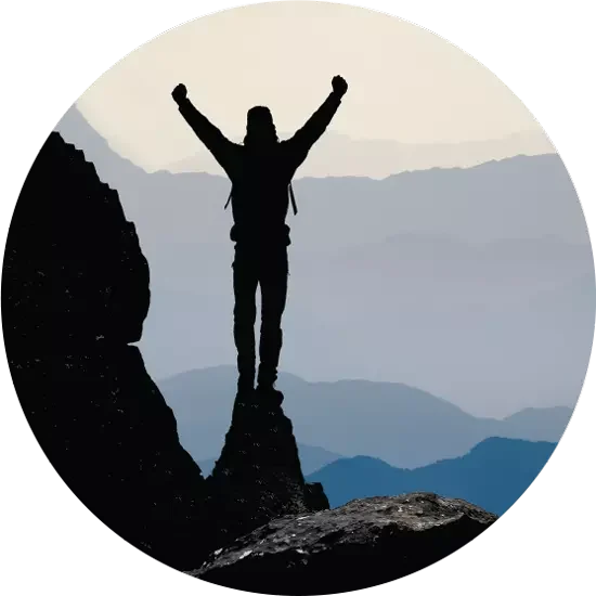 A climber at the summit at first light